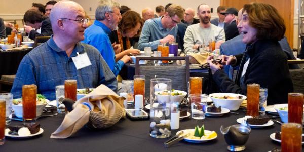 man and woman networking over lunch