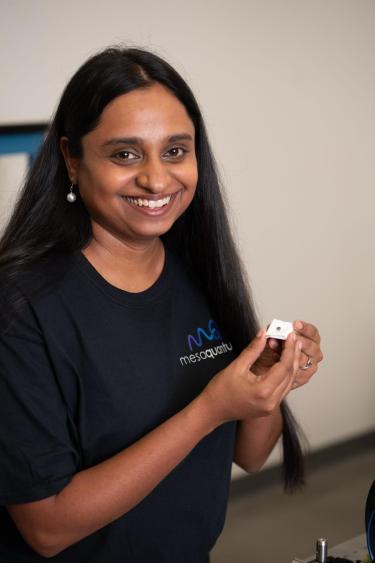 Sristy Agrawal poses with a small quantum device