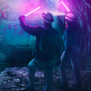 Illustration of explorers in a purple and blue cave