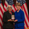 Arati Prabhakar, director of the White House Office of Science and Technology, awards Kristina Johnson, right, the National Medal of Technology and Innovation during an awards ceremony.