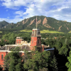 Old Main building in front of the flatirons
