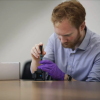 Man working on small device