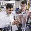 two students working on prototype in lab