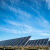 Solar panels win front of a blue sky