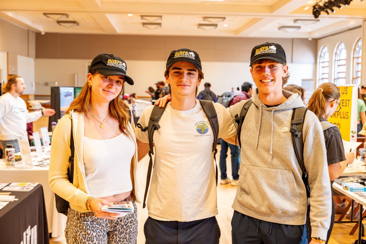 three students standing together