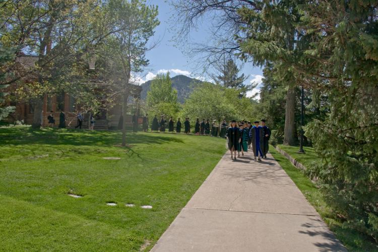 Graduates and Faculty process to Old Main