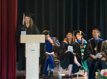 Erica Zwahlen introduces Dr. Misri, the commencement speaker