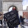 A woman holds a sign at the End The Violence Towards Asians rally in Washington Square Park on Feb. 20, 2021, in New York.Ron Adar/SOPA Images / Sipa USA via AP file